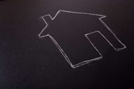 House shape is drawn on a blackboardの写真素材