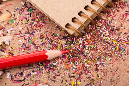 Red Color Pencil over some  pencil shavingsの写真素材