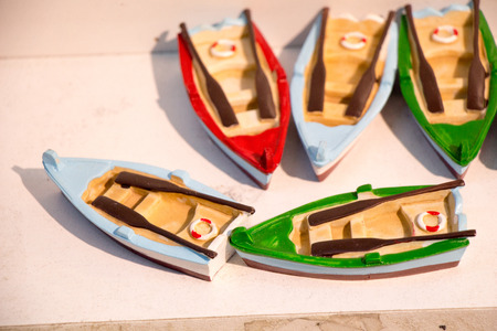 Set of small colorful wooden model boatsの写真素材
