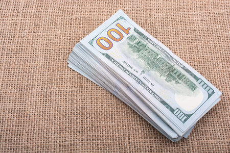 Banknotes of US dollars on canvas on a linen canvas
