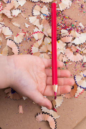 Red Color Pencil over  pencil shavingsの写真素材