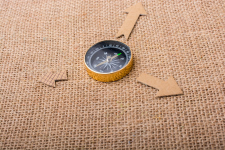 Compass and  paper arrow on a canvas backgroundの写真素材
