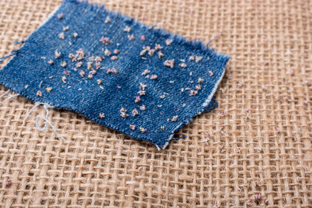 Denim canvas placed on  linen canvas as  a backgroundの写真素材