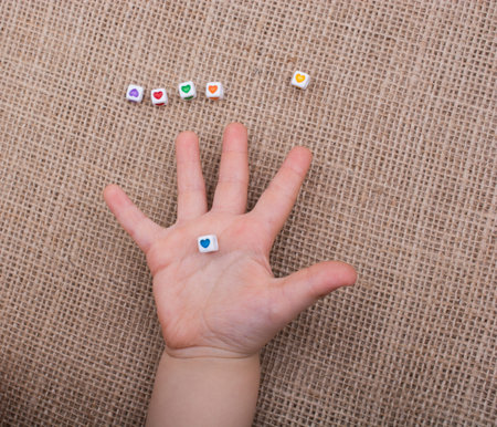 Heart shape placed between building blocksの写真素材