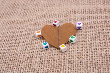 Colorful cubes with a heart  on leaf on canvasの写真素材