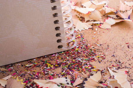 Spiral notebooks amid some colorful pencil trashの写真素材