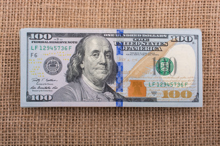 Banknotes of US dollars on canvas on a linen canvas