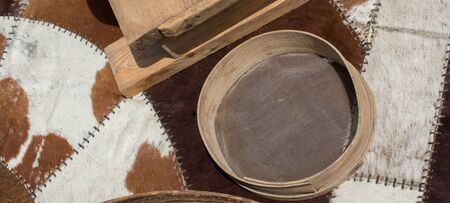 Traditional type sieve made of woodの写真素材