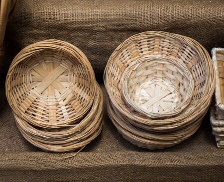 Empty wicker baskets are for sale in a market placeの写真素材
