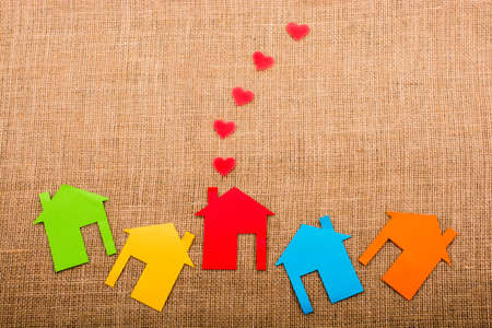 Heart shape coming out of chimney of paper houseの写真素材