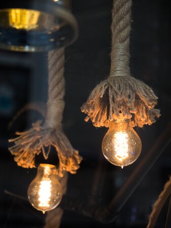 Decorative antique edison style filament light bulbs hangingの写真素材