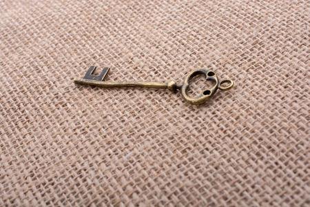 Retro styled golden color key on a linen canvas in viewの写真素材