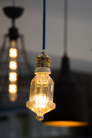 Decorative antique edison style filament light bulbs hangingの写真素材