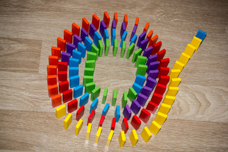 Colorful Domino Blocks in a line on a white background