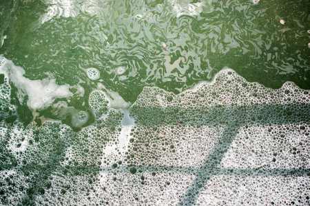Water surface as a background with foam and bubbles