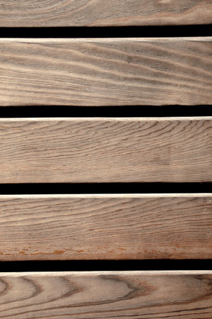 Texture details of an old wooden plunks as background