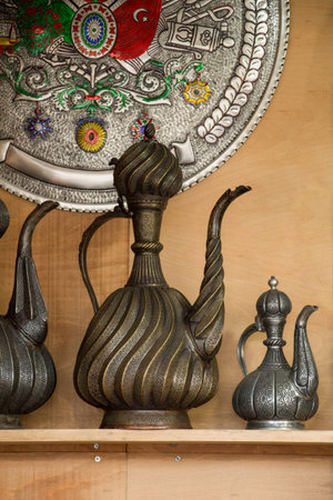 Ancient metal jug in oriental style  in antique market