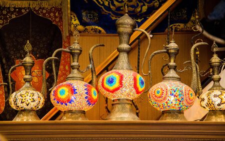 Ancient metal jug in oriental style  in antique marketの写真素材