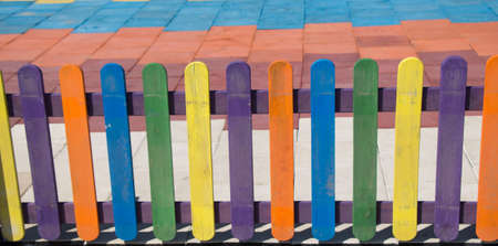Close up of a part of decorative colorful wooden fenceの写真素材