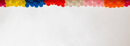 Color balloons on the roof of a buildingの写真素材