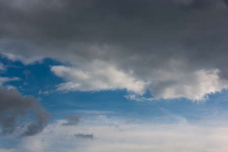 Dark and grey clouds are in the skyの写真素材
