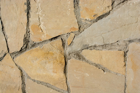 Wall made of the same type and same color of stones
