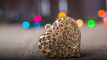 Christmas lights behind heart shaped  objectの写真素材