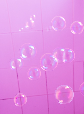 Blown  soap bubbles floating free in  the airの写真素材