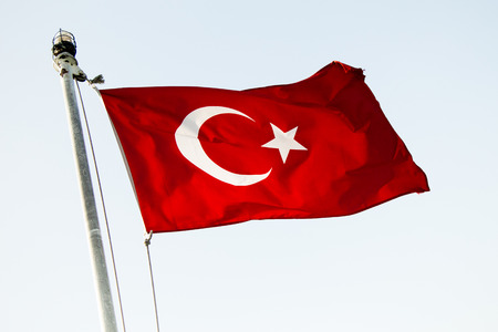 Turkish national flag hang on a pole in open airの写真素材