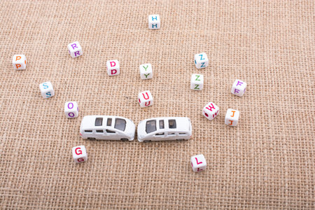 Letter cubes and  tiny toy car as a transportation device
