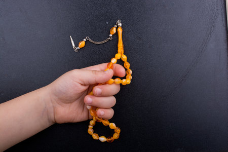 Set of praying beads of various colors on black