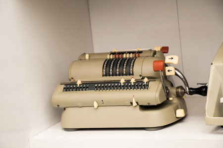 Retro syled tiny typewriter model on a white backgroundの写真素材