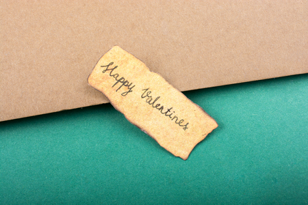 Valentine's day wording on torn paper as Love conceptの写真素材