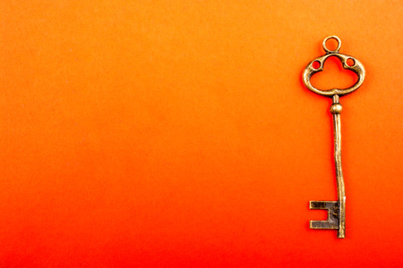 Retro style key on a colorful backgroundの写真素材