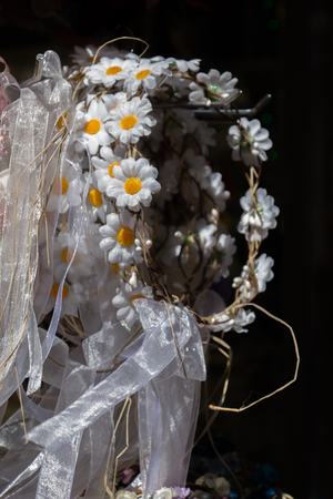 colorful crowns  for sale made of fake flowersの写真素材