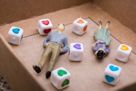 Heart shaped gold color metal object in handの写真素材