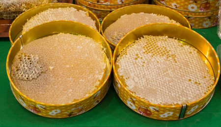 Sweet fresh honey in the sealed comb frameの写真素材