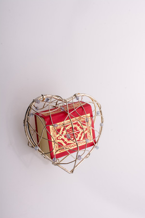 The Holy Quran in mini size in a heart shaped cageの写真素材