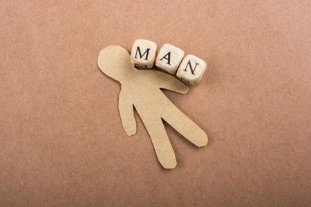 Paper man  and man wording with letter cubes on paperの写真素材