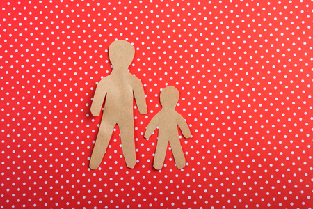 Men shape cut out of paper in hand in the viewの写真素材