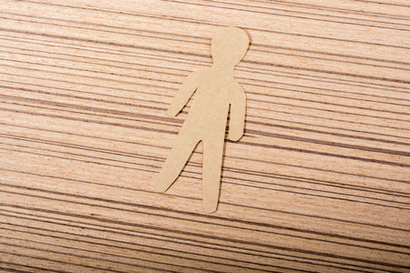 Man shape cut out of paper in hand in the viewの写真素材