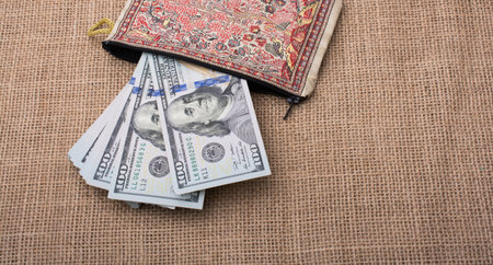 Banknote of US dollar in a purse on a linen canvas
