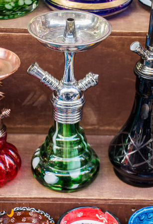 Group of eastern hookahs placed of various colors on a shelfの写真素材