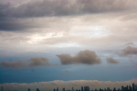 Blue Sky covered with white  and cloudsの写真素材