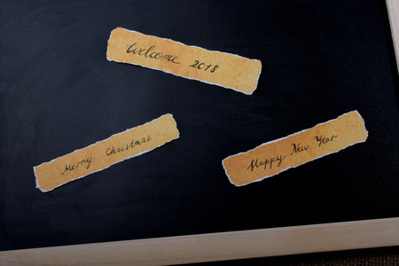 Happy new year,  Merry Christmas, Welcome 2018 written on boardの写真素材