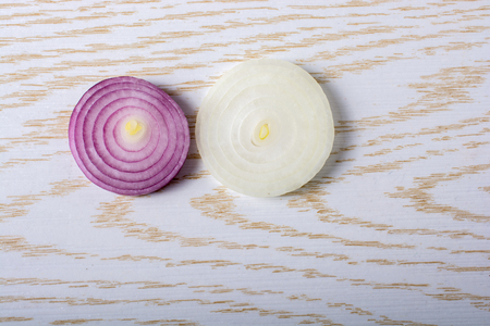 Sliced onion rings and  onion slices  on the backgroundの写真素材