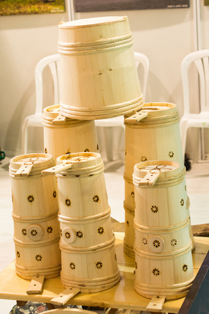 Set of buckets made of wood in a market placeの写真素材