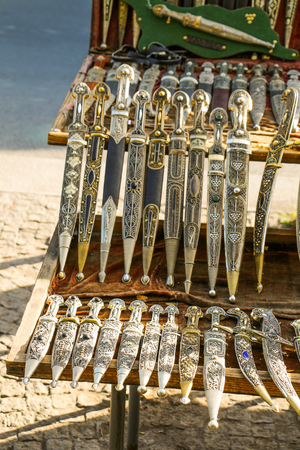 Ancient style daggers in Bazaar  of Tbilisiの写真素材