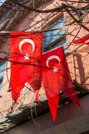 Turkish national flag hanging in the street in open airの写真素材