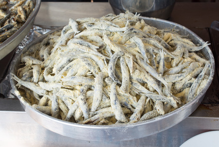 Tray with ready to fry anchovies fish fish as seafoodの写真素材